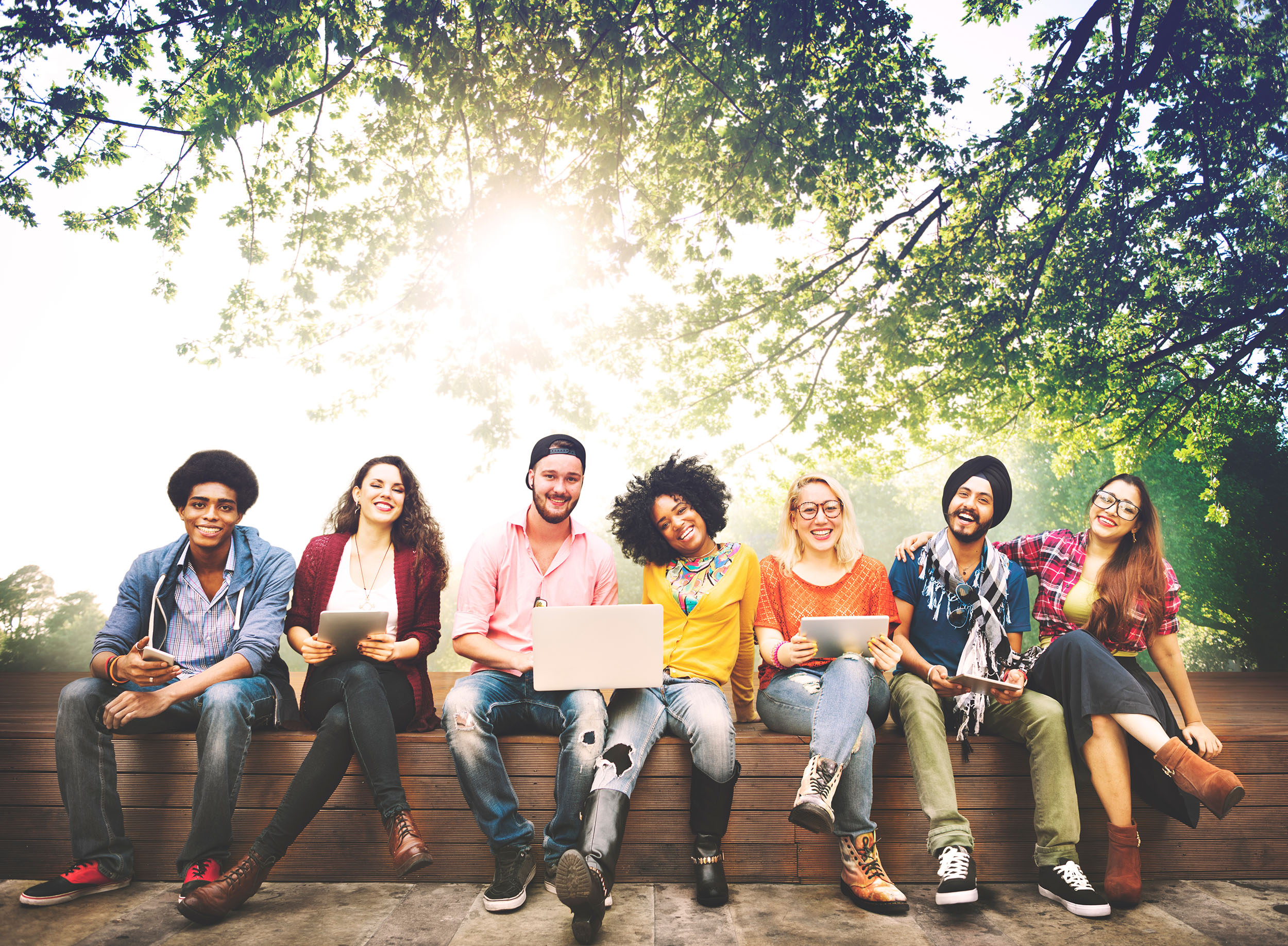 Teenagers Sitting together in a row -Helen and Harvey Pell Fund for College Students