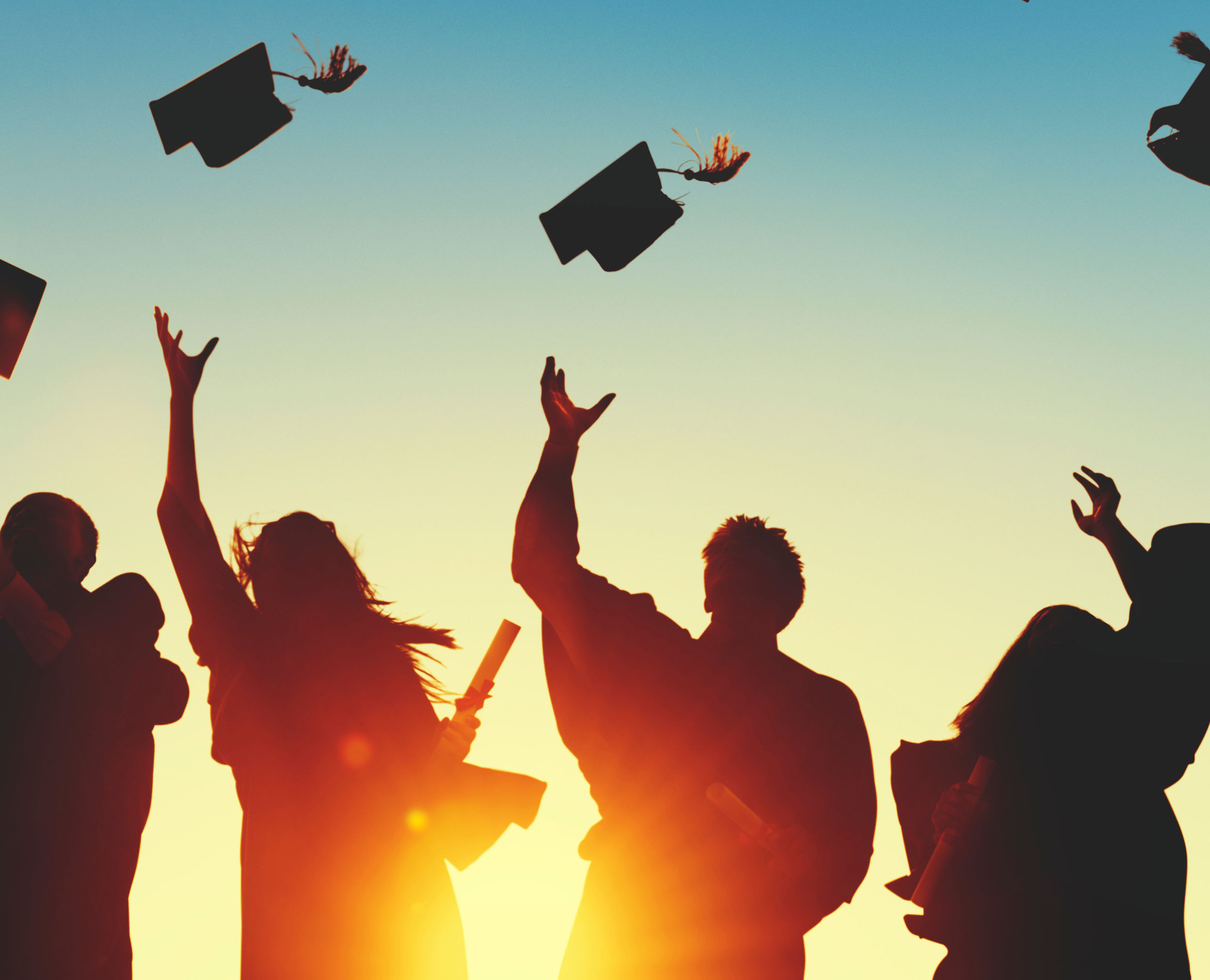 Grads tossing hats in air. Helen and Harvey Pell Fund for Professional Development