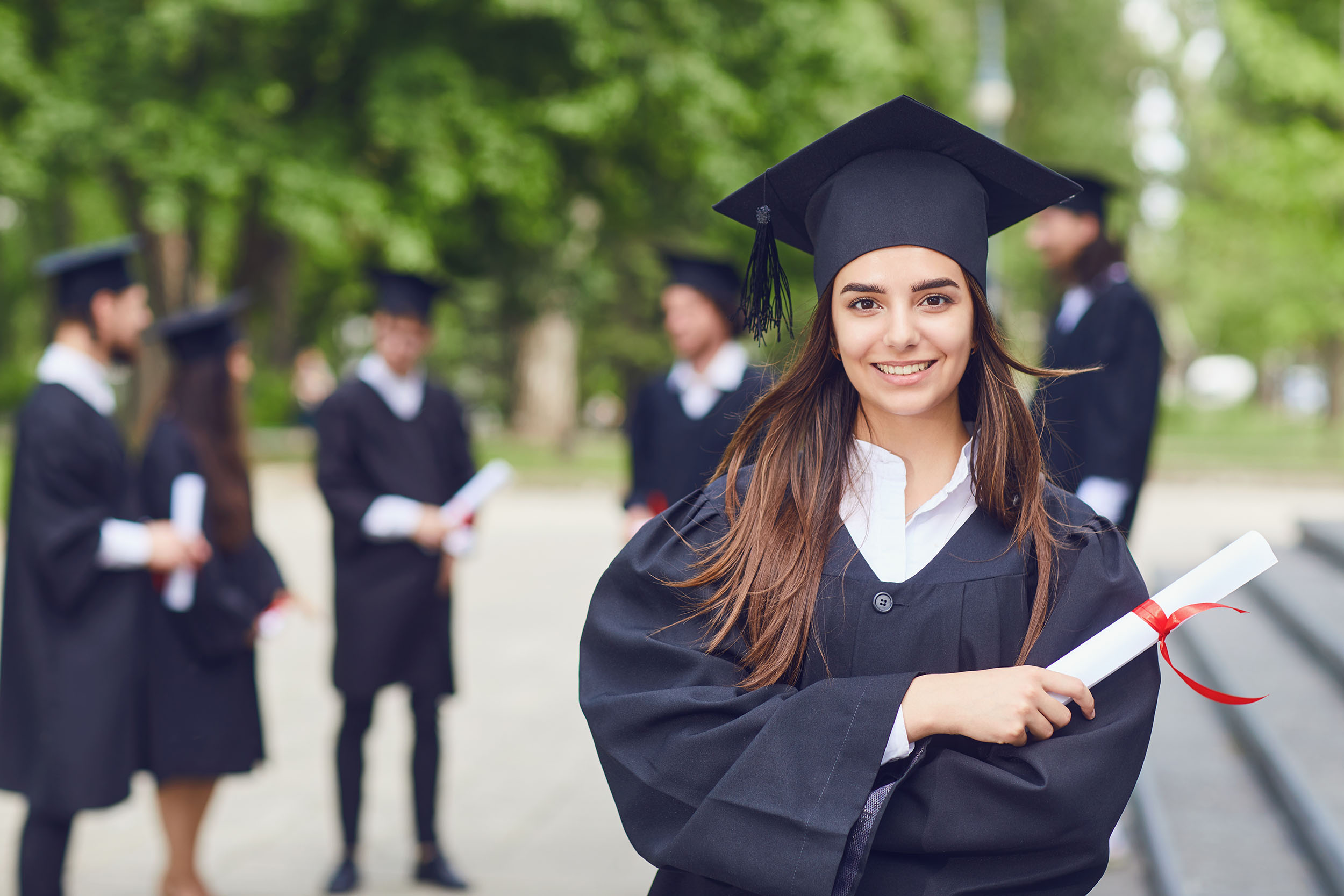 Young Woman in graduation gown - Workman Fund of Hope Scholarship- Graduating High School Students